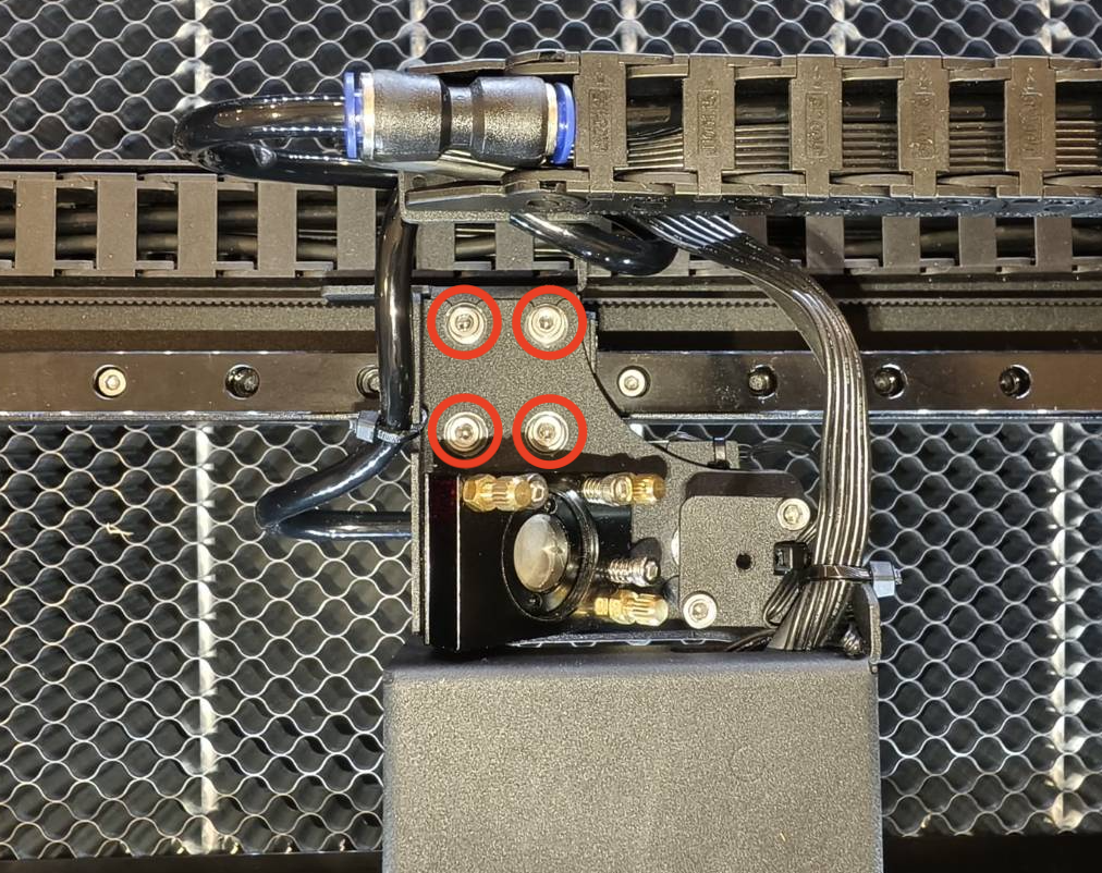 Loosen laser head screws